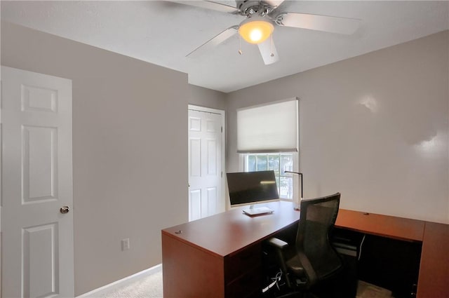 office featuring light carpet and ceiling fan