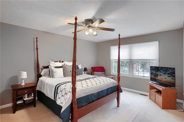 bedroom with light carpet and ceiling fan