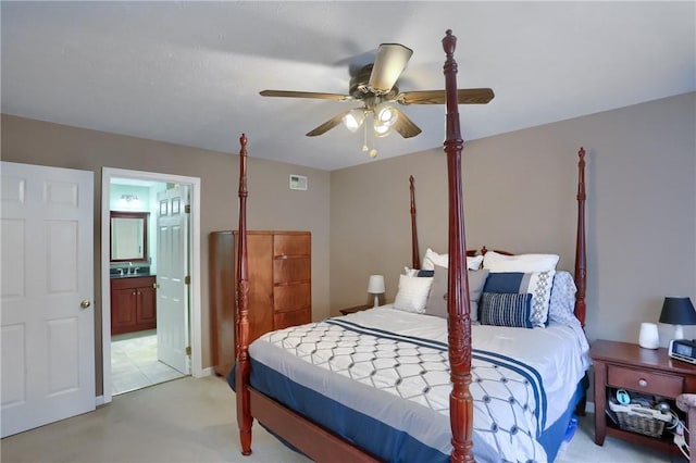 bedroom featuring connected bathroom and ceiling fan