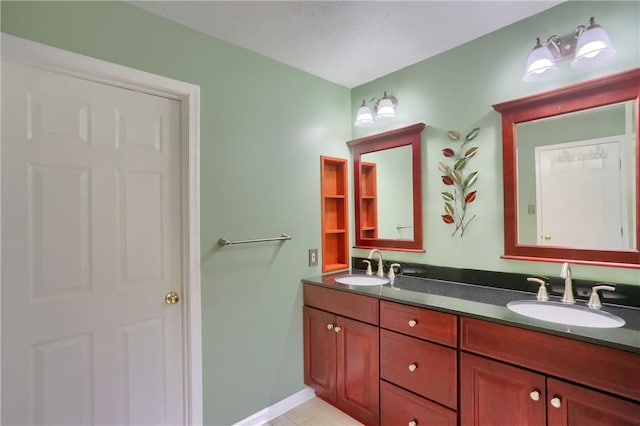 bathroom featuring tile patterned flooring and vanity