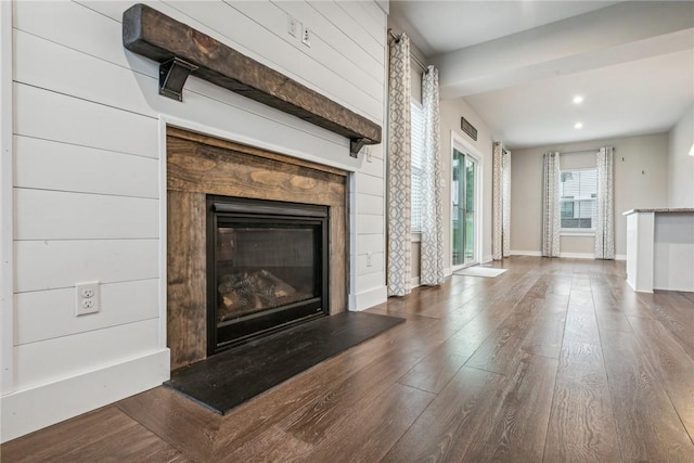 unfurnished living room with dark hardwood / wood-style flooring