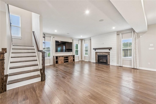 unfurnished living room featuring hardwood / wood-style floors