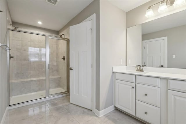 bathroom with vanity and walk in shower