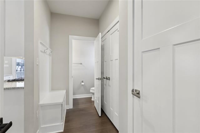 corridor with dark wood-type flooring