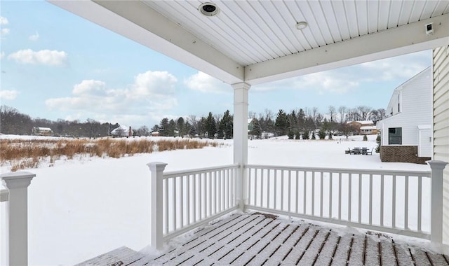 view of snow covered deck