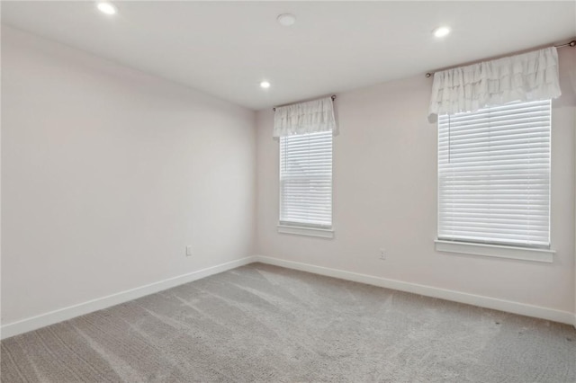 empty room featuring light carpet