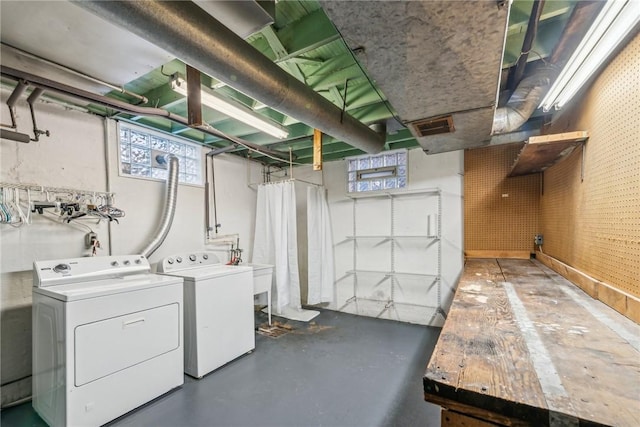 laundry room with independent washer and dryer and sink