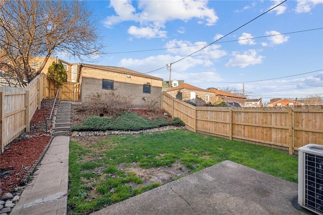 view of yard with central AC