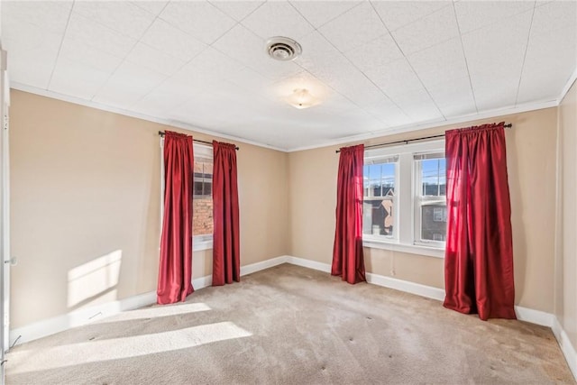 carpeted empty room with ornamental molding