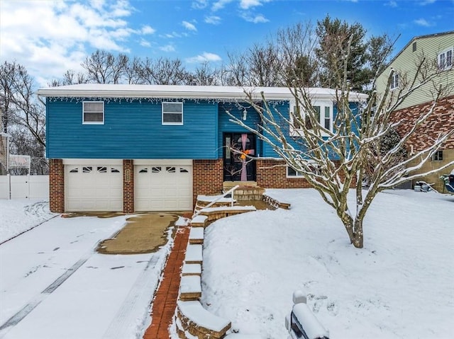 split foyer home featuring a garage