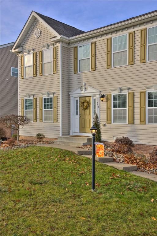 view of front of home with a front yard