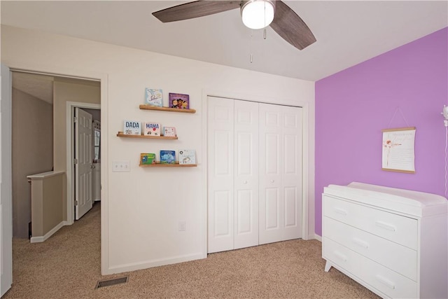 unfurnished bedroom with ceiling fan and light carpet