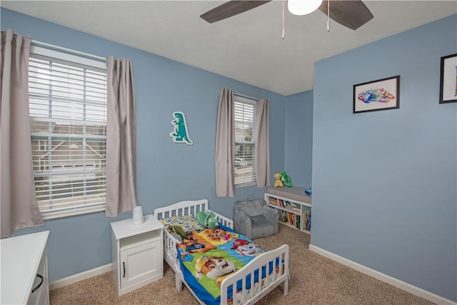 carpeted bedroom featuring ceiling fan