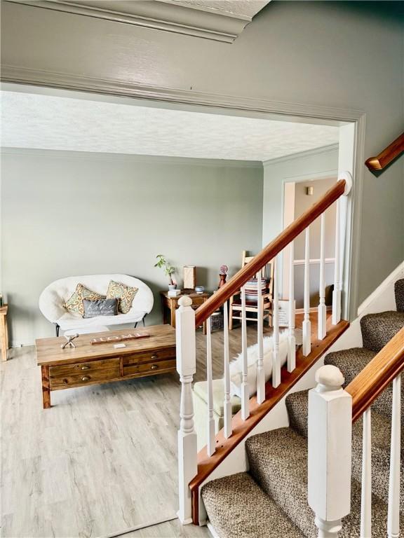 staircase with wood-type flooring