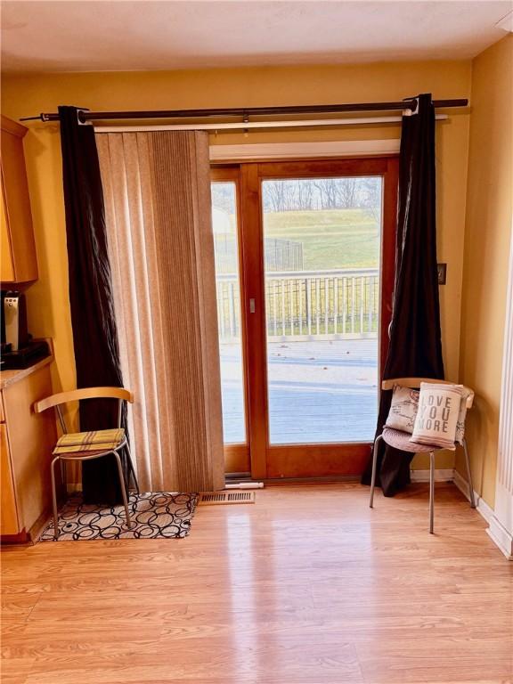 entryway with light hardwood / wood-style floors