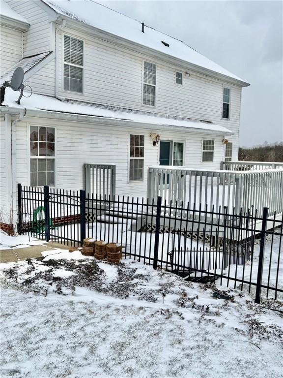 view of snow covered house