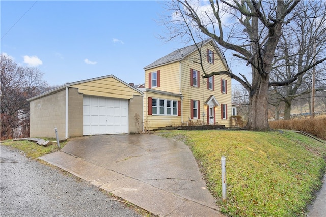 view of front of house with a garage and a front yard