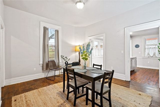 dining area featuring dark hardwood / wood-style floors