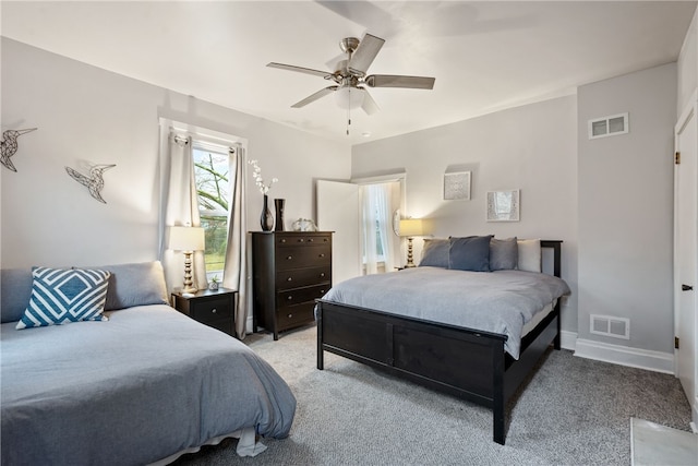 carpeted bedroom with ceiling fan