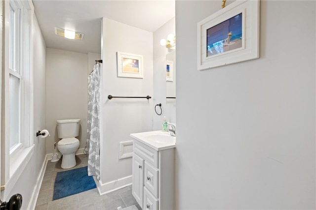 bathroom with tile patterned floors, vanity, and toilet