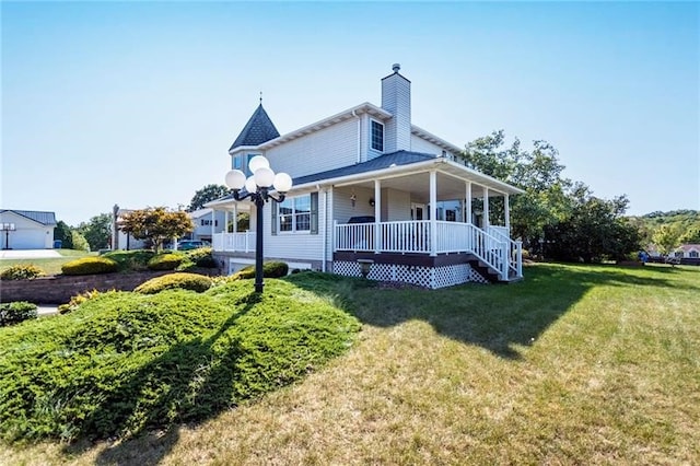 view of home's exterior with a yard and a porch