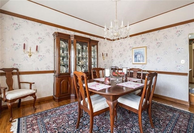 dining space featuring dark hardwood / wood-style flooring and a notable chandelier