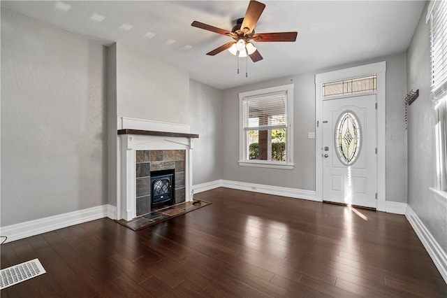 entryway featuring ceiling fan and dark wood-type flooring