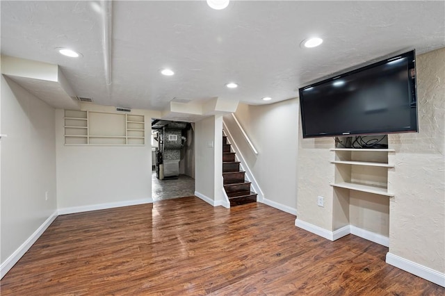 basement with dark wood-type flooring