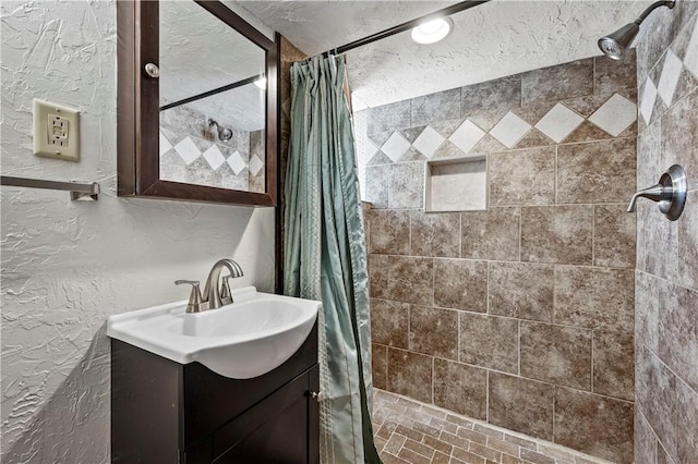 bathroom featuring vanity and walk in shower