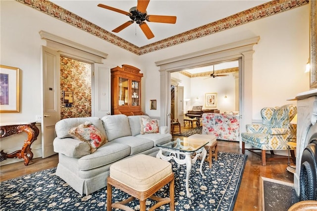 living room featuring dark hardwood / wood-style floors and crown molding