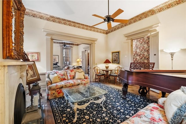 interior space featuring hardwood / wood-style flooring, ceiling fan, and a premium fireplace