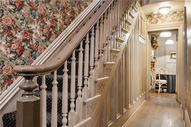 staircase with hardwood / wood-style flooring