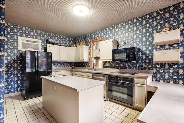 kitchen with a kitchen island with sink, sink, light tile patterned floors, and black appliances