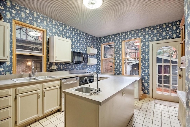 kitchen featuring dishwasher, sink, a kitchen island, cream cabinets, and light tile patterned flooring