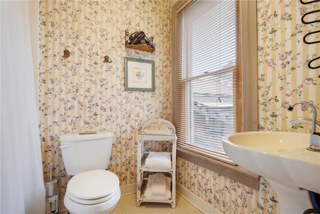 bathroom featuring tile patterned floors, sink, and toilet