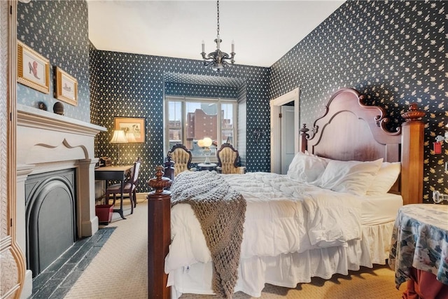 bedroom featuring a chandelier and carpet floors