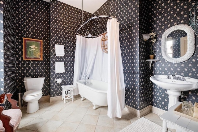 full bathroom featuring tile patterned floors, sink, shower / tub combo, and toilet