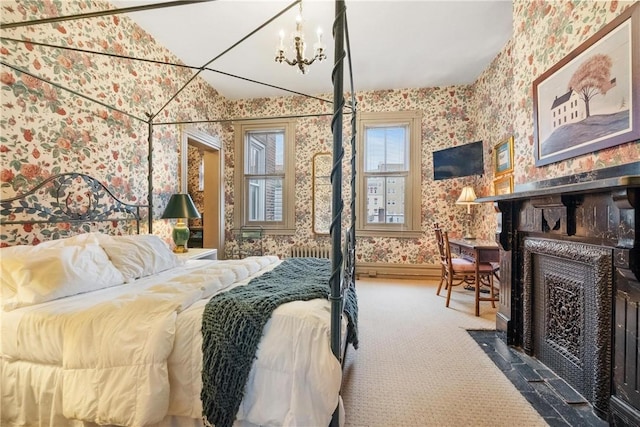 bedroom featuring carpet and a chandelier