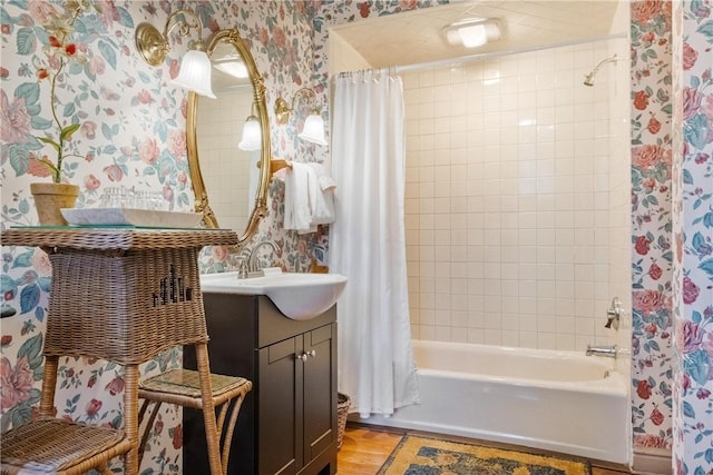 bathroom featuring shower / bath combo, wood-type flooring, and vanity