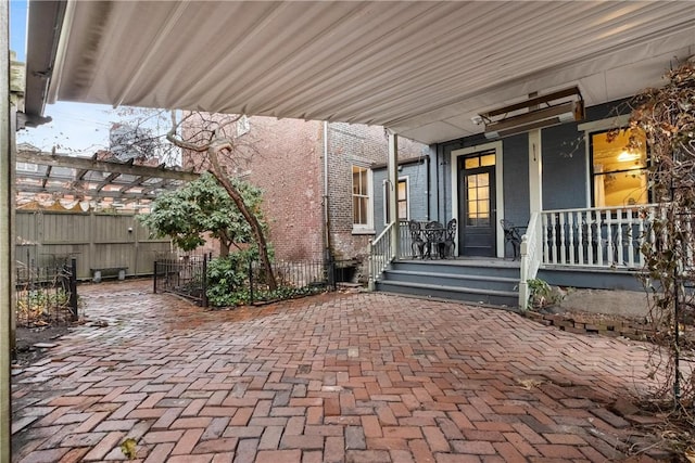 view of patio / terrace with covered porch and a pergola