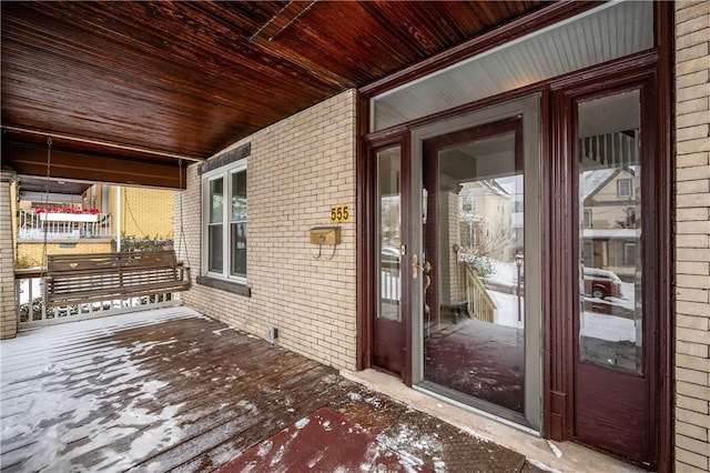 wooden terrace featuring covered porch