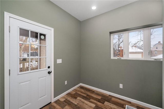 doorway to outside featuring dark wood-type flooring