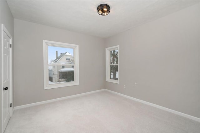 empty room with light colored carpet