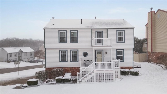 view of front of home with a balcony