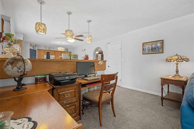 carpeted office space featuring ceiling fan