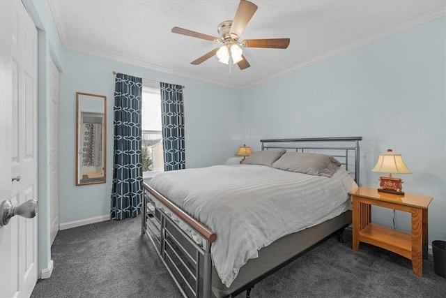 carpeted bedroom featuring ceiling fan and crown molding