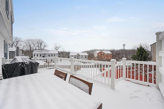 snow covered patio with grilling area