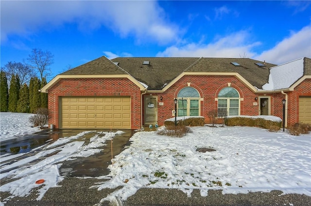 ranch-style house featuring a garage