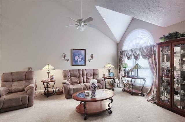 carpeted living room with a textured ceiling, ceiling fan, and vaulted ceiling