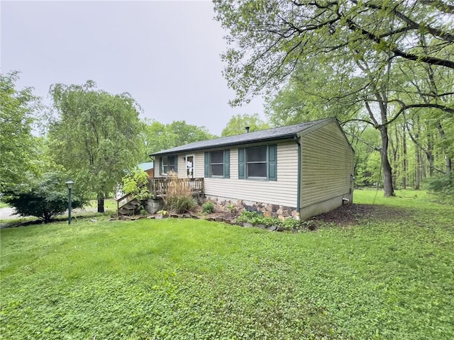 119 Deer Rd, Loyalhanna, PA 15681 - view of side of property with a wooden deck and a yard